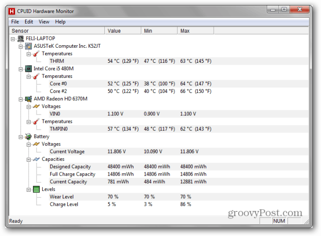 Captura de pantalla de una computadora de escritorio con Windows 7 con HWMonitor en segundo plano y un mensaje de advertencia del sistema acerca de considerar reemplazar la batería de la computadora portátil