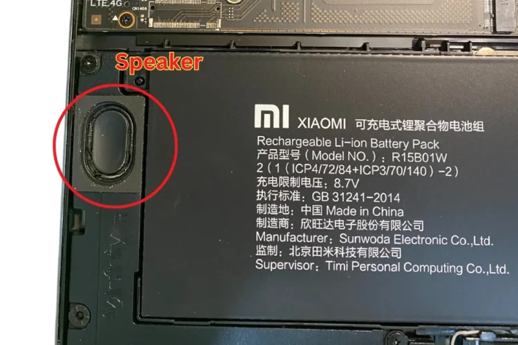 A close-up photo of a Xiaomi laptop speaker that has been broken, no sound, not working