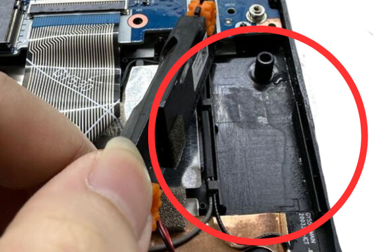 Image of an audio port with visible water damage caused by spilled water.