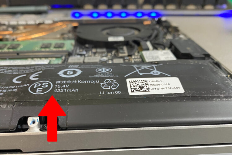 Close-up image of a bloated Razer RZ09-0328 laptop battery.